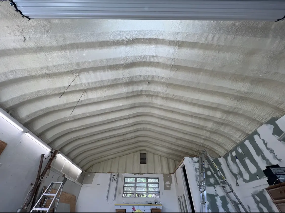Spray polyurethane foam applied to the underside of a metal roof deck in Oakland